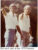 Two men in white shirts pointing at the 1979 Masters golf tournament, vintage photograph.